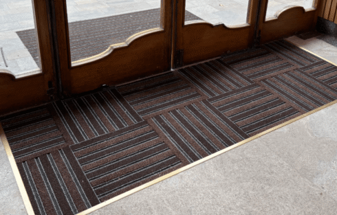 Entrance matting installed in a matwell with floor trim finishes