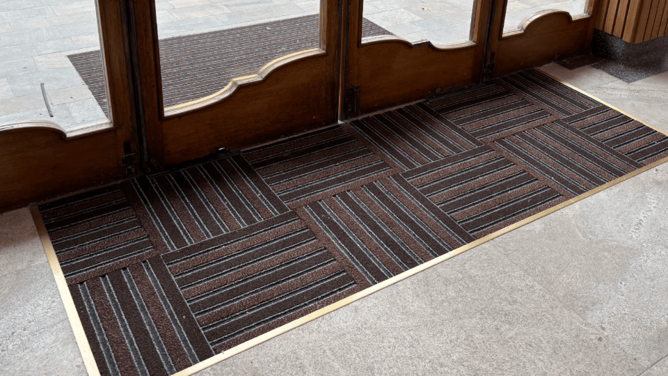Entrance matting installed in a matwell with floor trim finishes